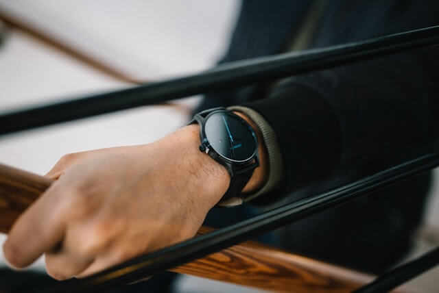 man wearing a black elegant watch