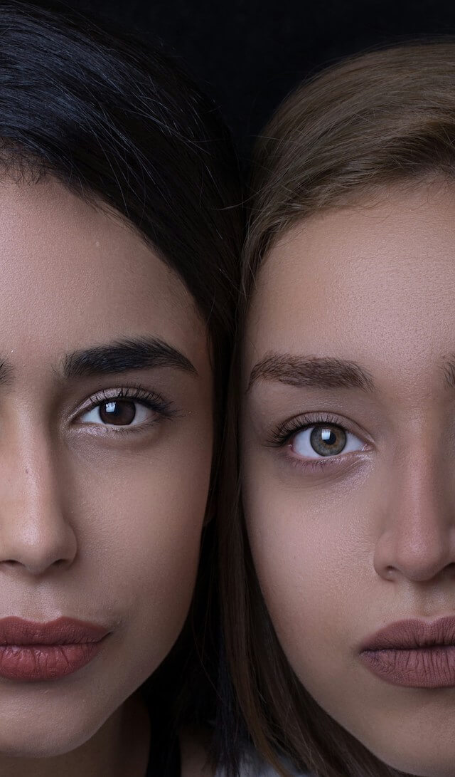 two women with brown eyes and black hair looking at the camera